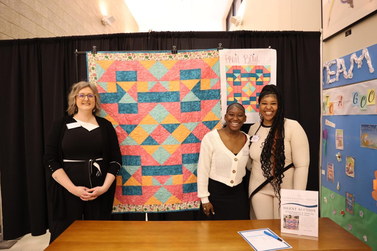 Ms. Skinner and some of her math students attended the gala to showcase a quilt made with a design created by the students.