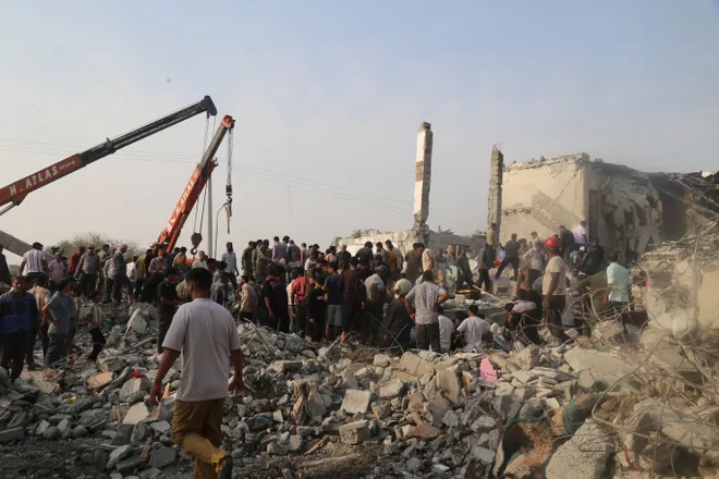 People and rescue forces worked following a strike on a school in Minab, Iran, on Feb. 28